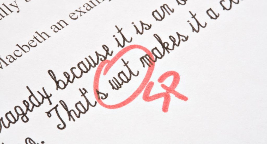 spelling mistake highlighted and pointed out on a piece of work by a child